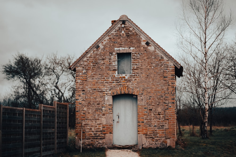 an old brick building with a white door