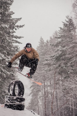 Snowboarders performing tricks in the snow.