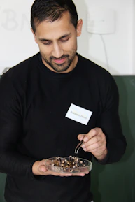 Friendly call center agent assisting a customer with pest control inquiries.
