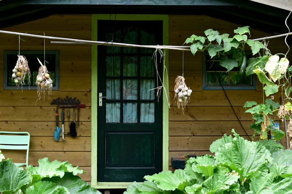 a green chair sitting in front of a green door