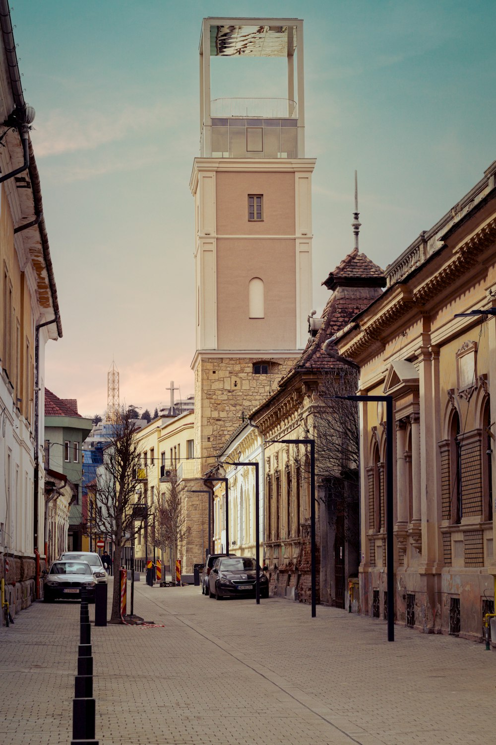 a tall clock tower towering over a city street