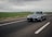 Image of a sleek modern muscle car cruising on an open highway post-tune.