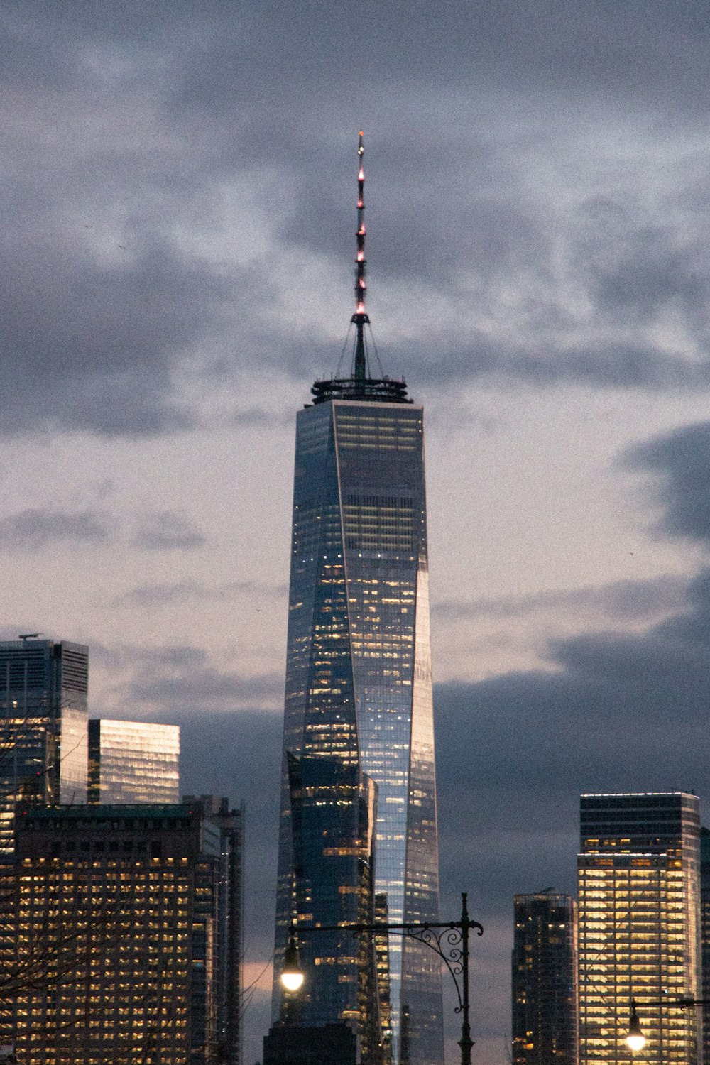 a very tall building towering over a city