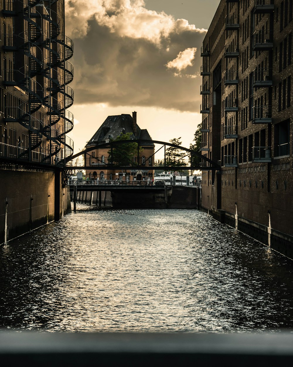 a river running through a city next to tall buildings