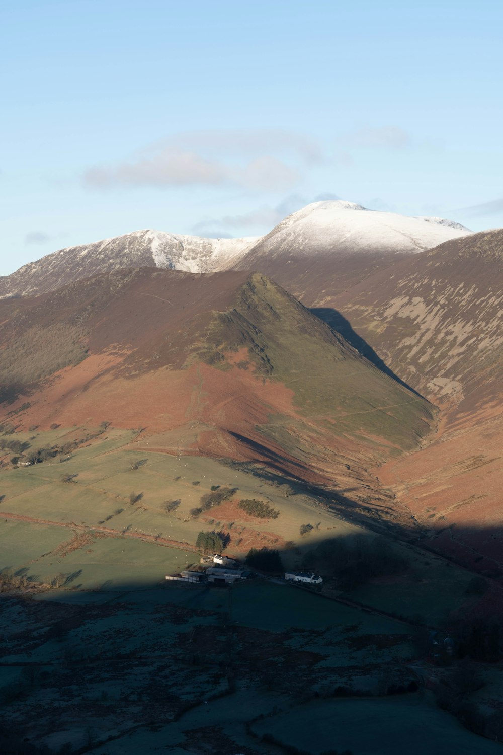 a view of a mountain range with snow on the top