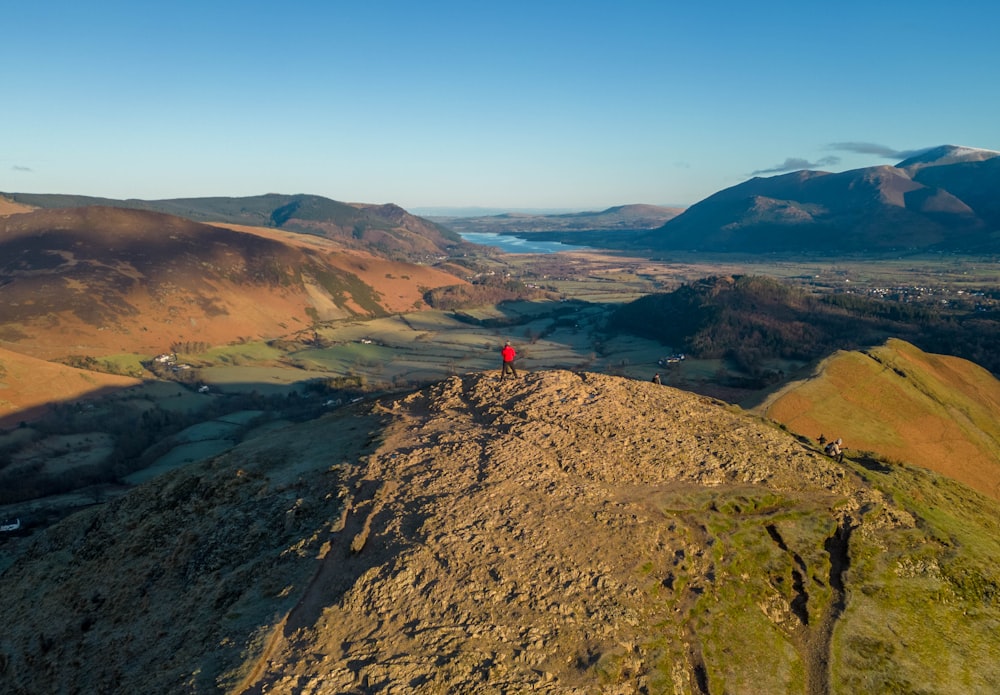 a person standing on top of a mountain