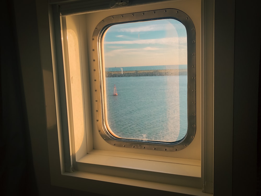 a window with a view of a body of water