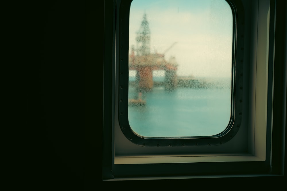 a window with a view of a bridge through it