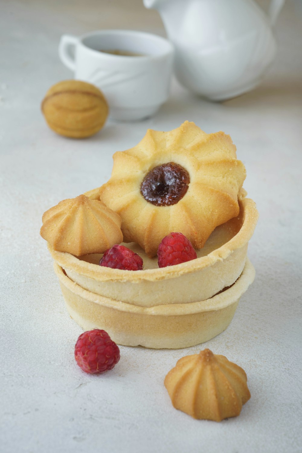 a pastry dish with raspberries in a bowl