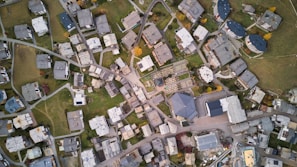 An aerial view of a residential area with planned layouts visible.
