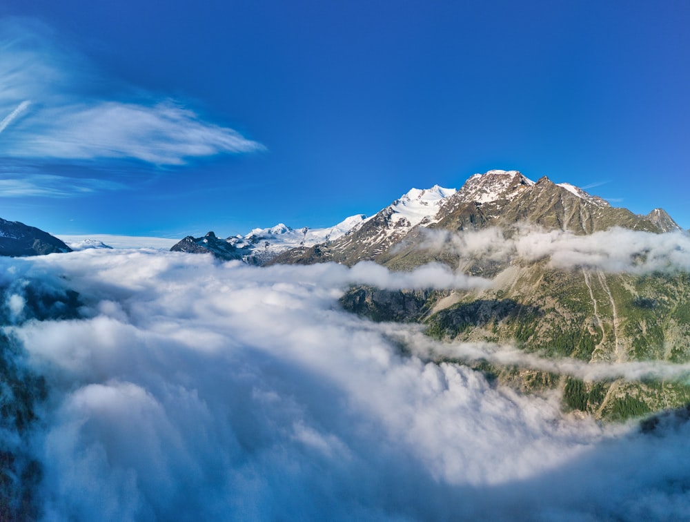 a view of a mountain covered in clouds