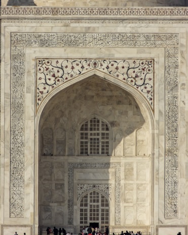 a group of people standing in front of a white building