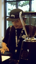 Close-up of a customer using the Sunday Coffee touchscreen interface to customize their drink.
