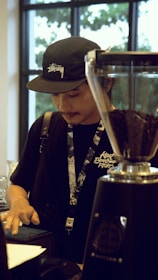 Technician providing hands-on support for a POS system in a busy café.