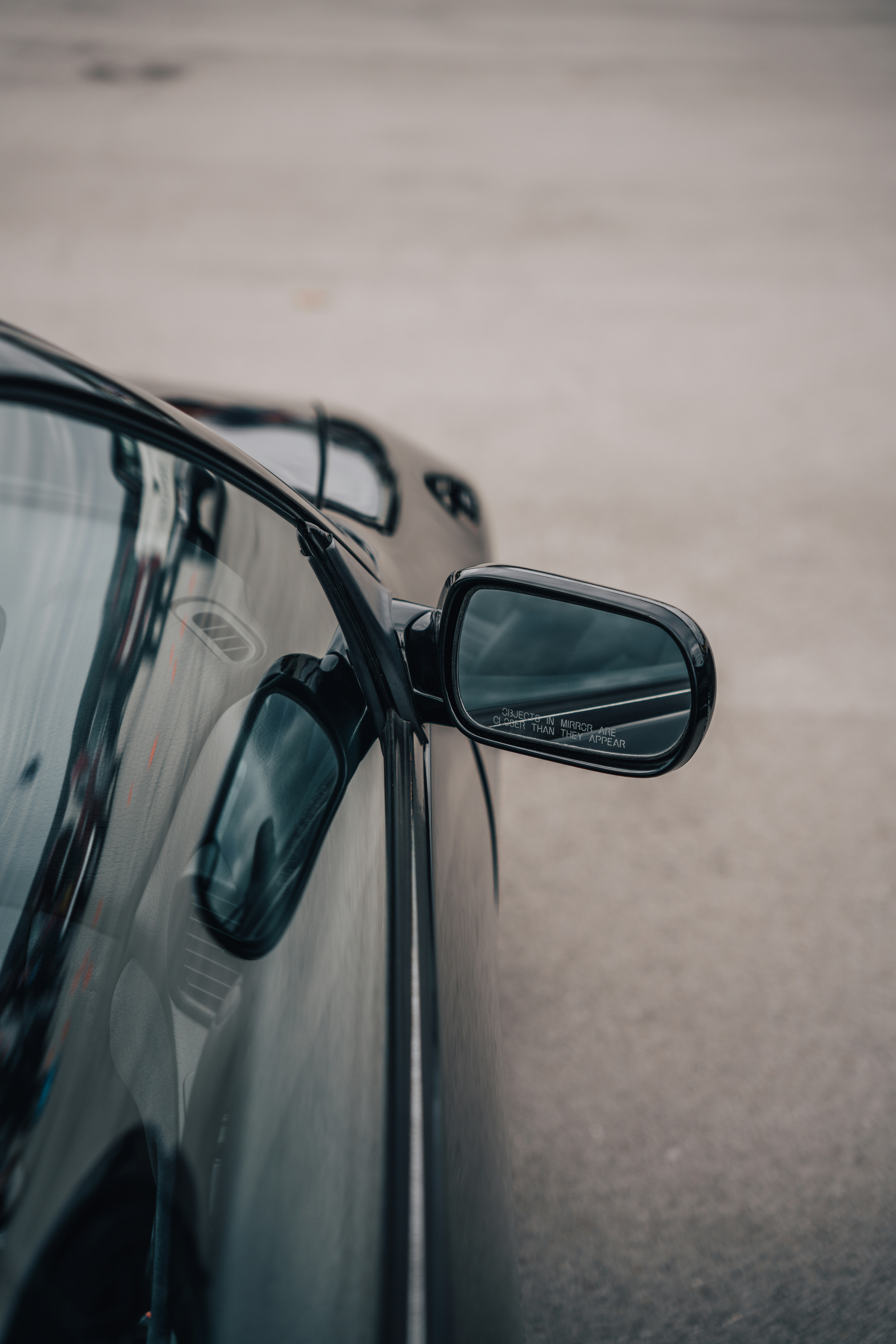 a close up of a car's side view mirror
