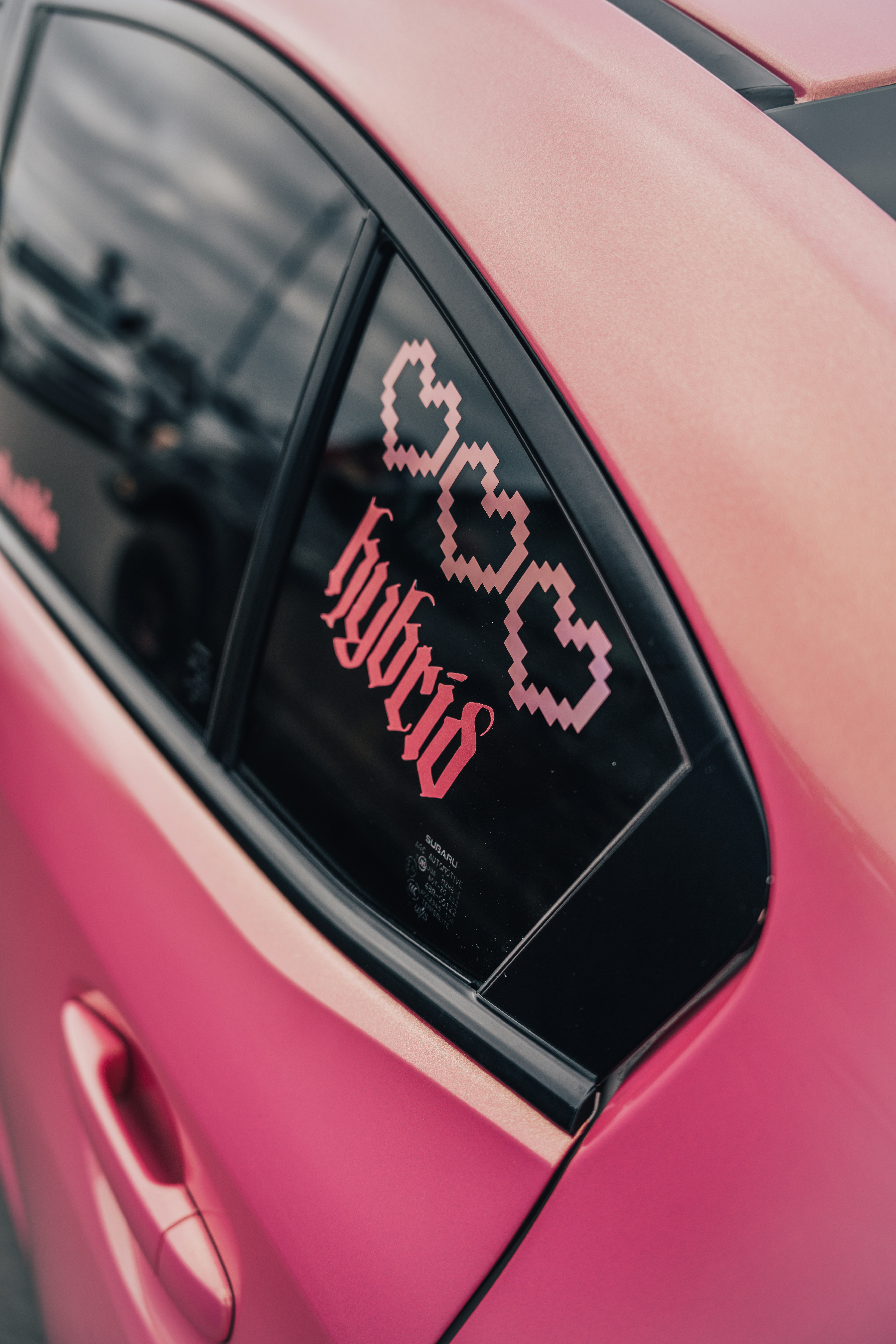 A pink car with a pink sticker on it's side window photo – Free Vehicle ...