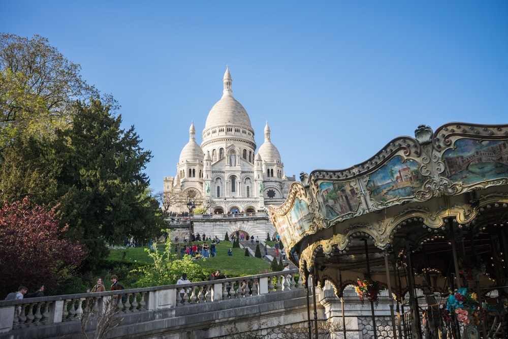 a merry go round in front of a large building