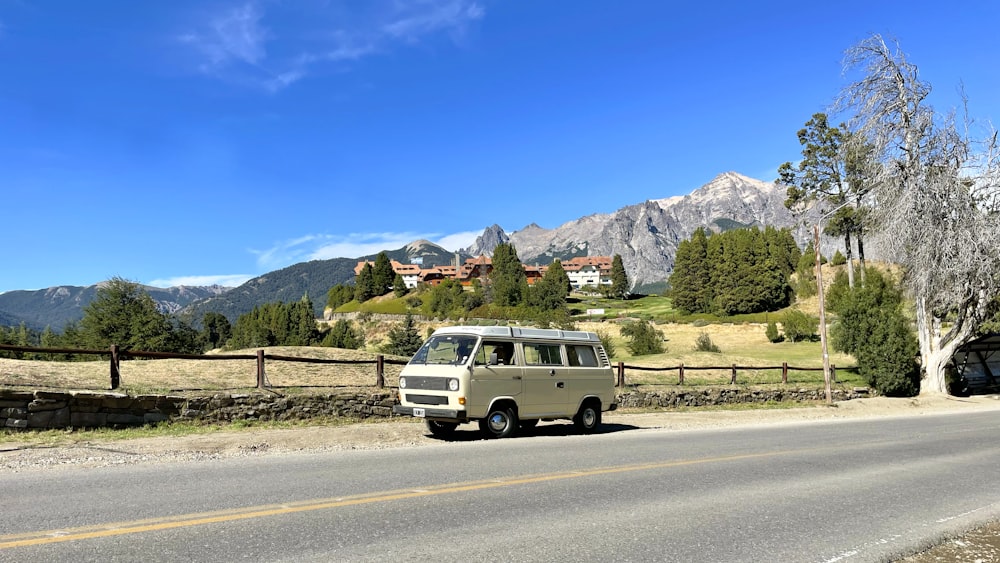 a van is parked on the side of the road