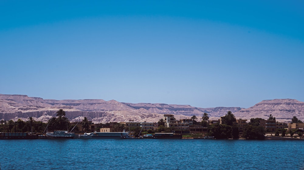 a body of water with a mountain in the background