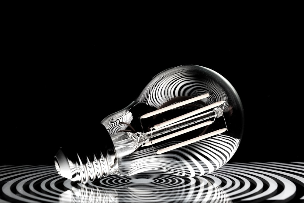 a black and white photo of a light bulb