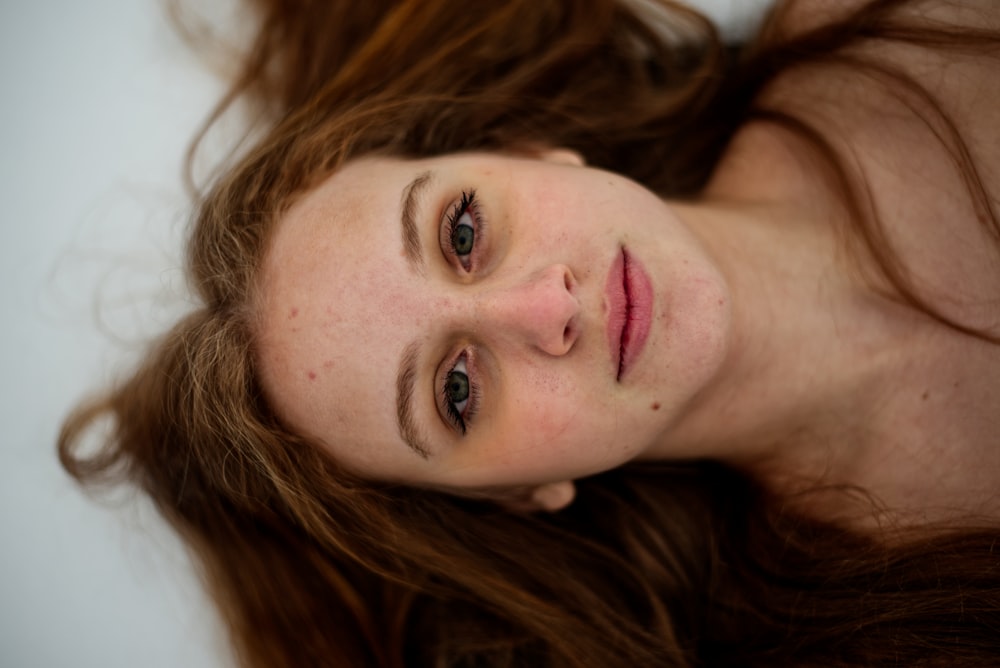 a close up of a woman with long hair