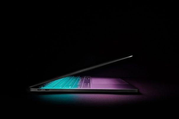 A sleek, futuristic quantum computer glowing softly in a darkened lab environment.