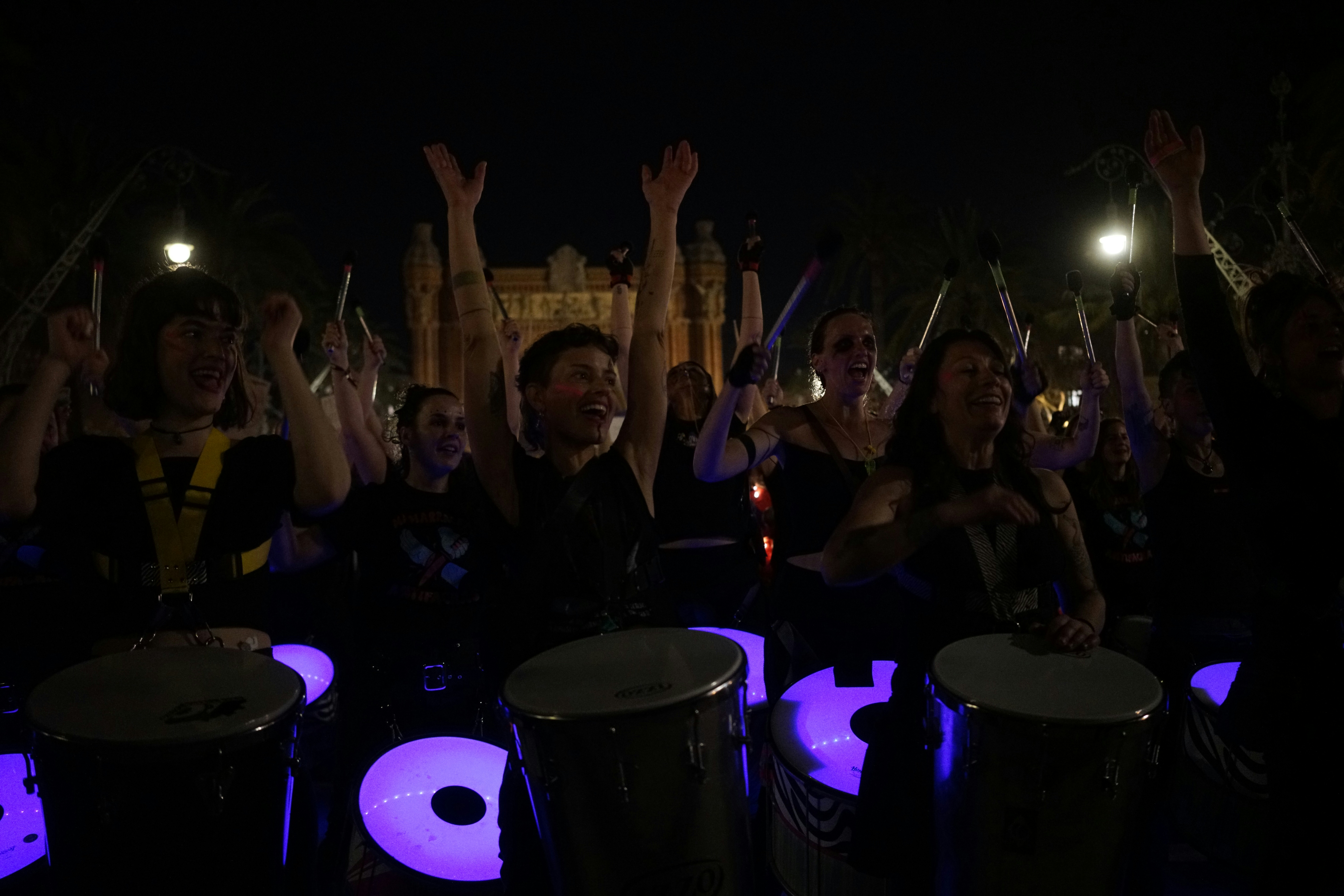 8.03.2023, Barcelona, Spain. The procession of women through the streets of Barcelona in a demonstration for their rights. An orchestra of female drummers walks through the streets and plays music