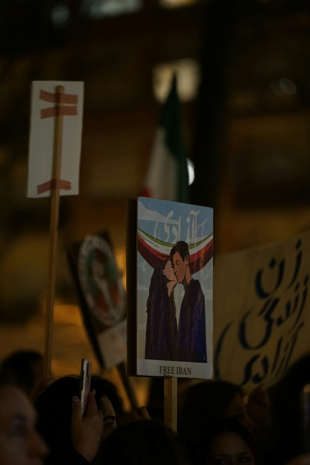 a group of people holding signs and flags