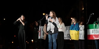 a group of people standing on top of a stage