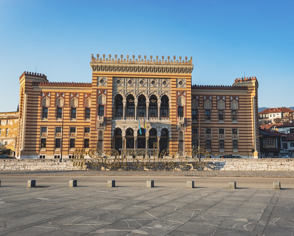 a large building with a clock tower in front of it