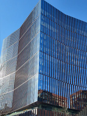 Modern glass-fronted office building with clean architectural lines.