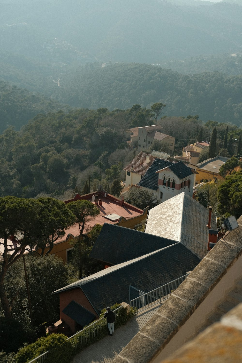 a view of a town with mountains in the background