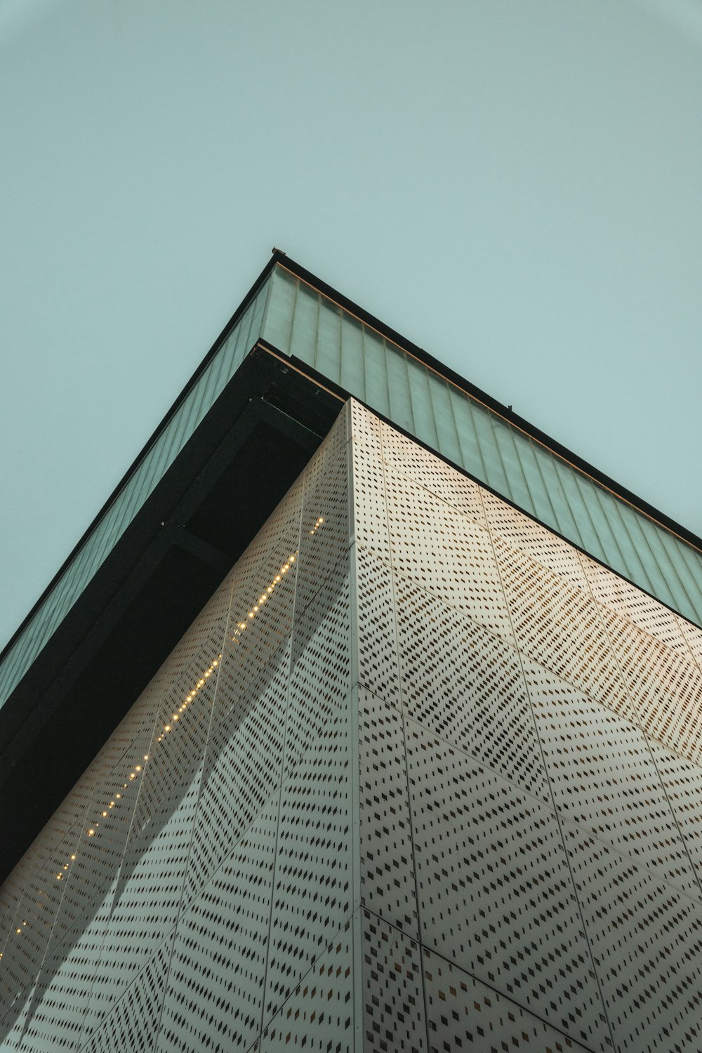 a close up of a building with a sky background