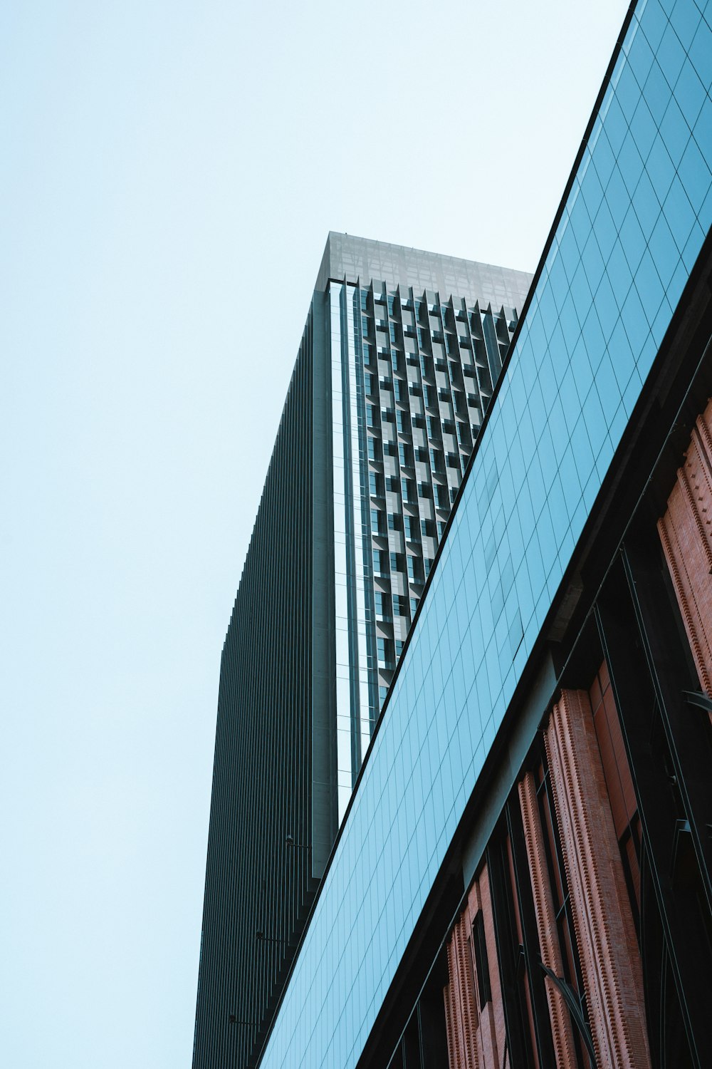 a very tall building next to a very tall building