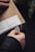 Close-up of hands unpacking household items from a delivery box at home.