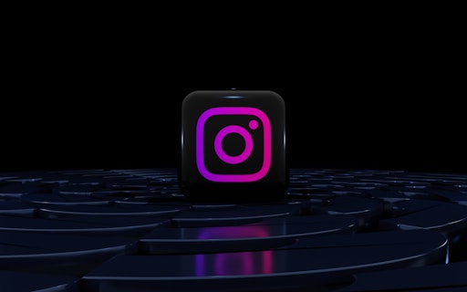a purple instagram logo on a black background