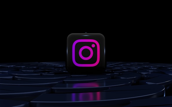 a purple instagram logo on a black background