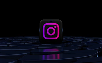 a purple instagram logo on a black background