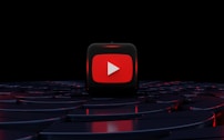 a red play button on a black background