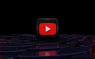 a red play button on a black background