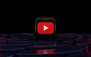 a red play button on a black background