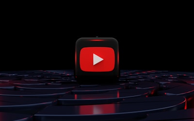 a red play button on a black background