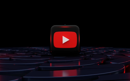 a red play button on a black background