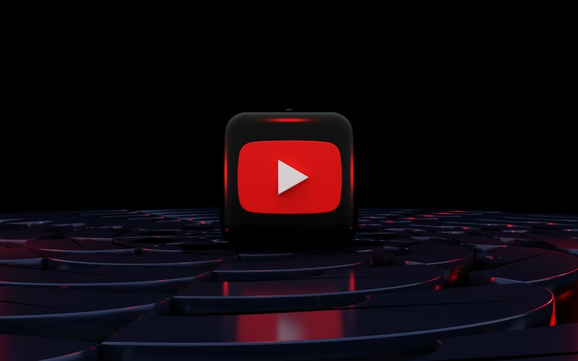 a red play button on a black background