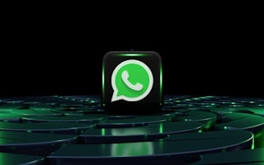 a green whatsapp icon sitting on top of a maze
