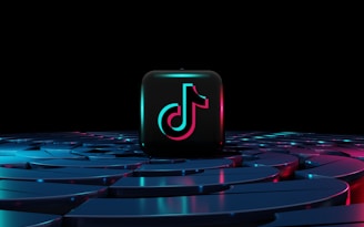 a square button sitting on top of a circular table