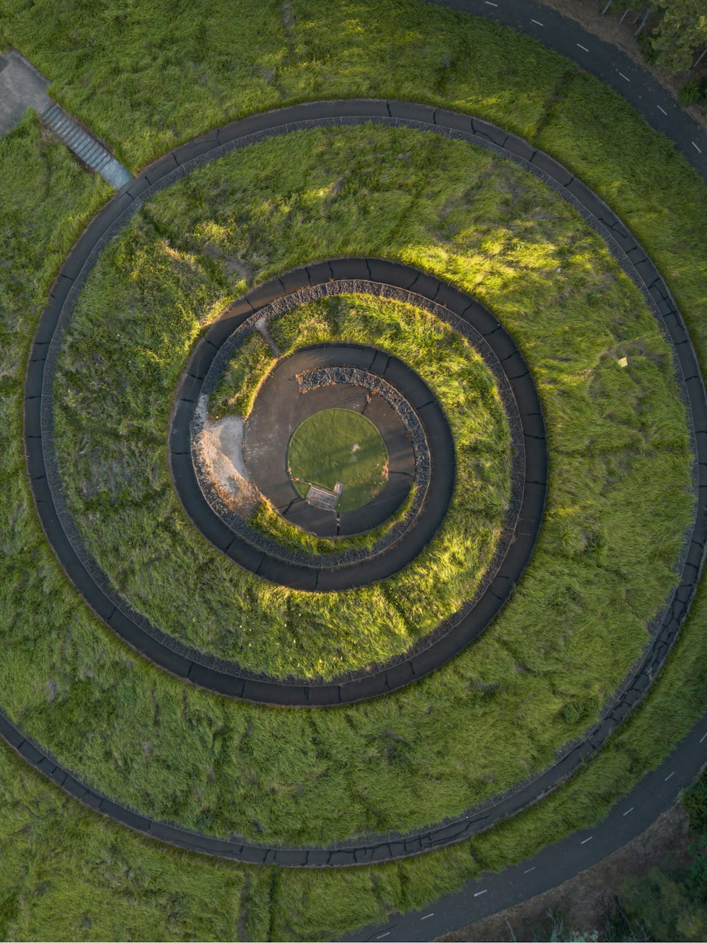an aerial view of a circular grassy area