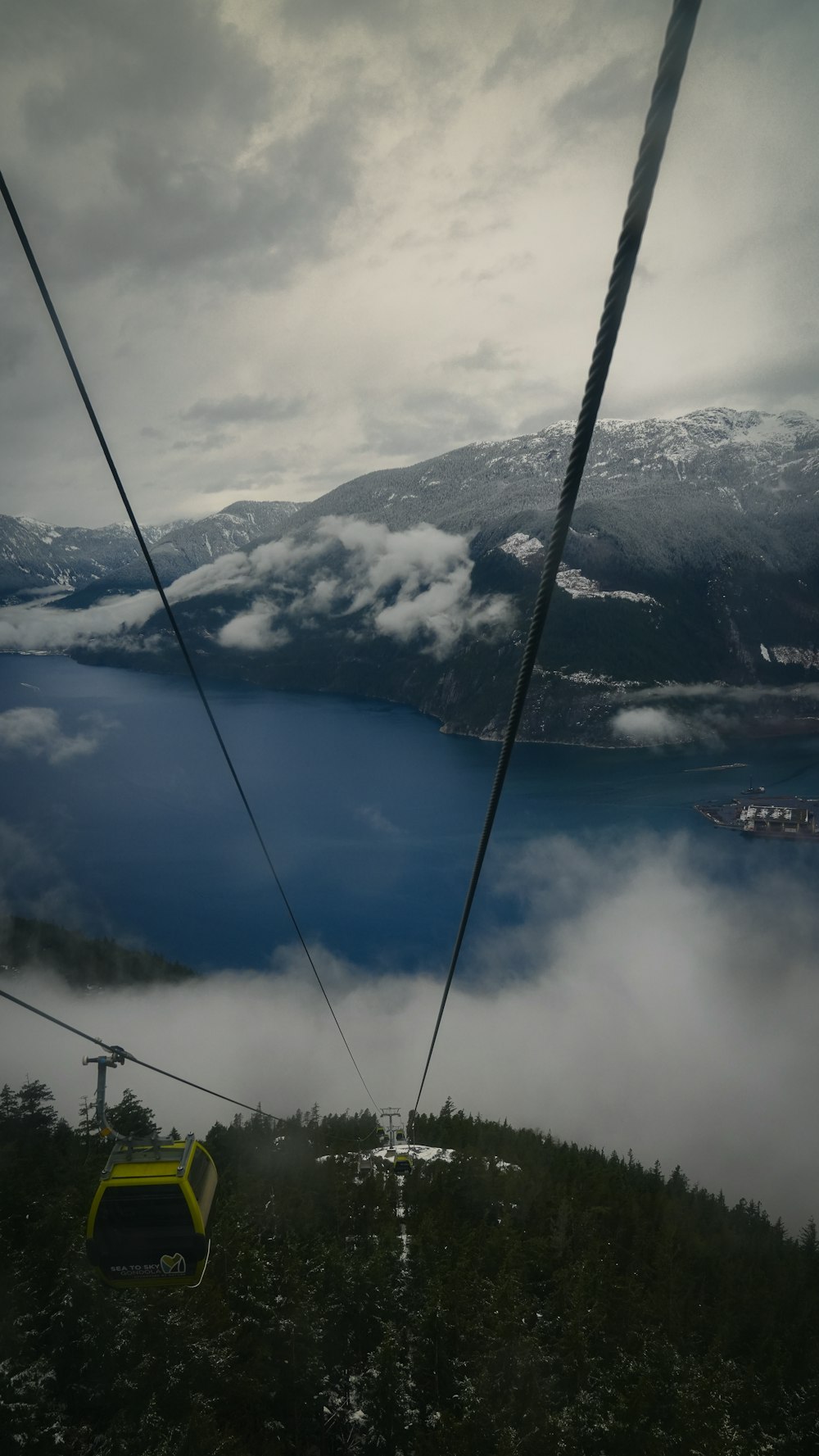 a ski lift with a view of a lake