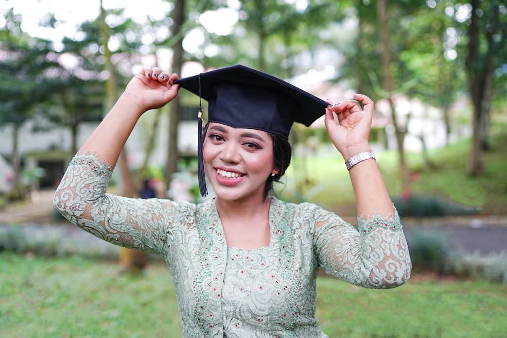 a woman in a graduation cap and gown