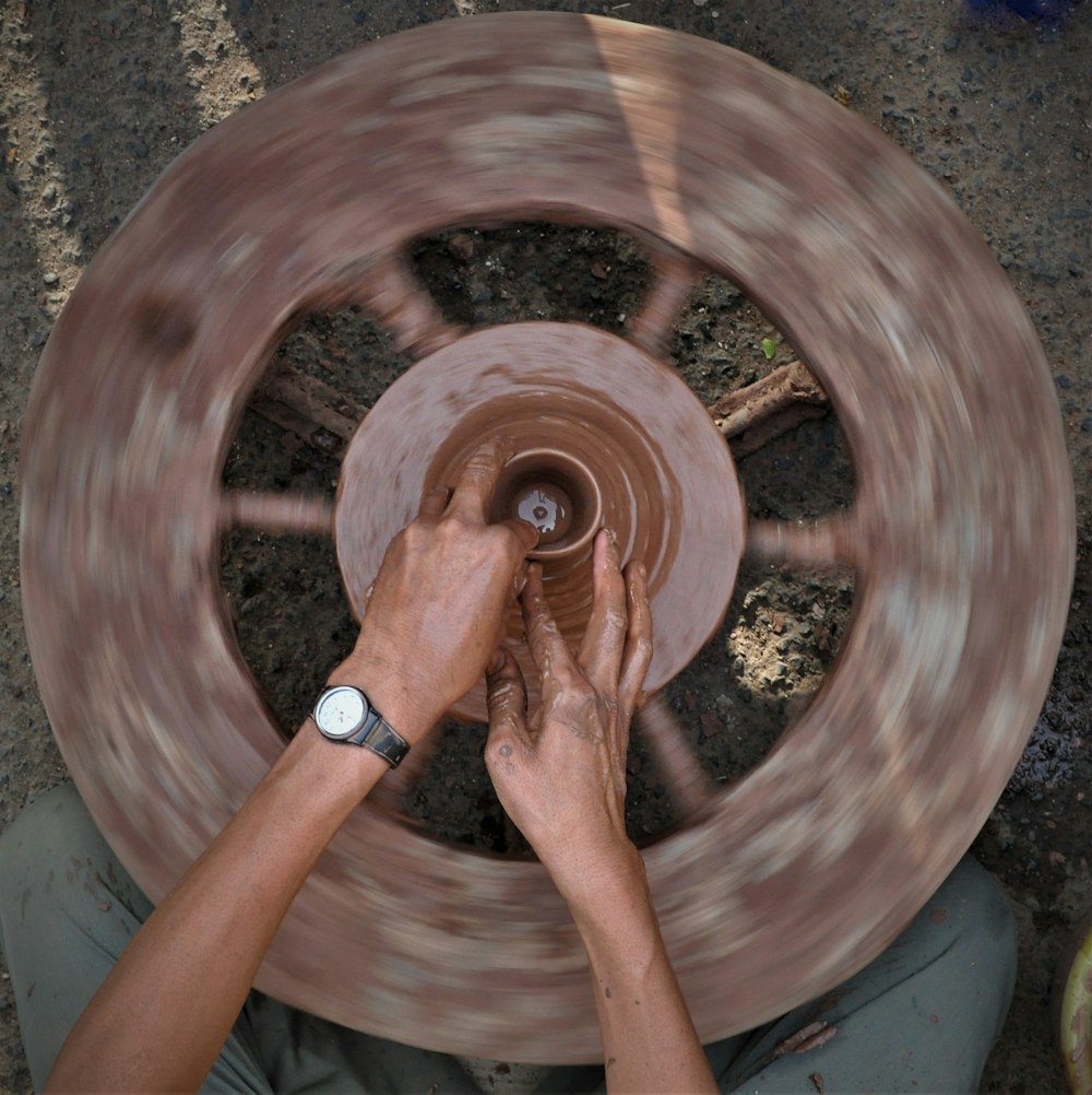 a man is spinning a wheel on a spinning wheel